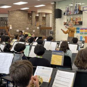 Marybeth Kurnat directs 6th-grade band practice